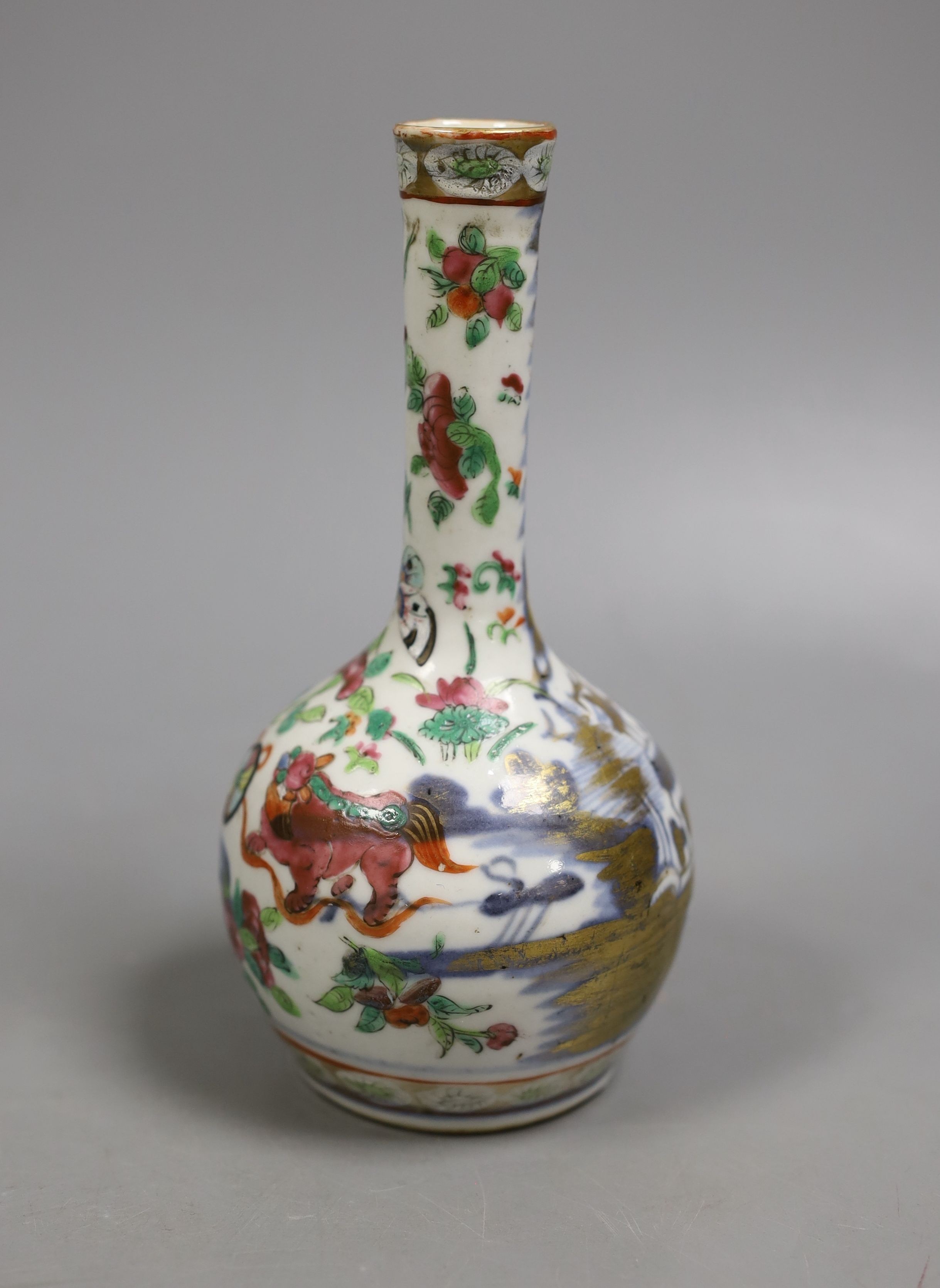 A 19th century Chinese famille rose bottle vase (dogs of fo), 17 cms high.